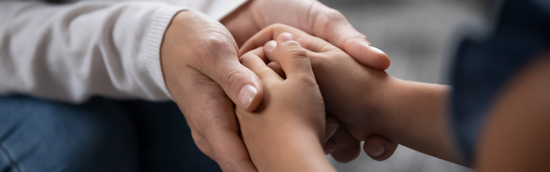 Parent and child holding hands